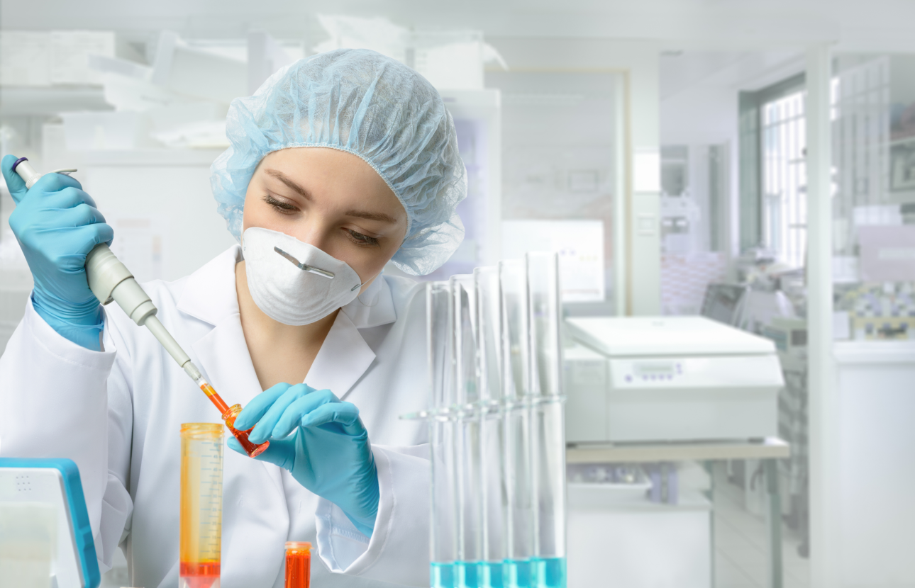 Medical researcher filling test tubes.